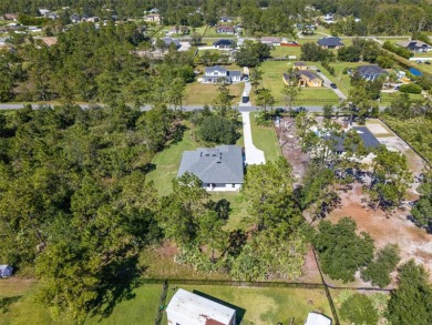 Where Luxury Meets Comfort -- Your Dream Home Awaits on a Full on Wedgefield Golf Club in Florida - for sale on GolfHomes.com, golf home, golf lot