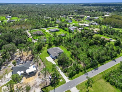 Where Luxury Meets Comfort -- Your Dream Home Awaits on a Full on Wedgefield Golf Club in Florida - for sale on GolfHomes.com, golf home, golf lot
