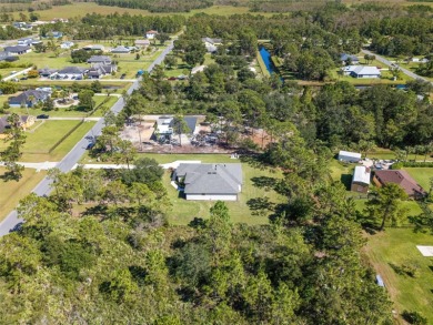 Where Luxury Meets Comfort -- Your Dream Home Awaits on a Full on Wedgefield Golf Club in Florida - for sale on GolfHomes.com, golf home, golf lot