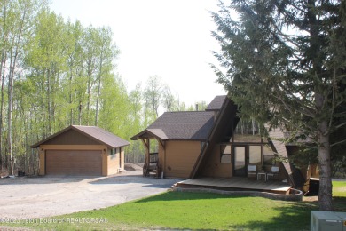 The Cabin is located in the trees, Conveniently located to Aspen on Aspen Hills Golf Course in Wyoming - for sale on GolfHomes.com, golf home, golf lot