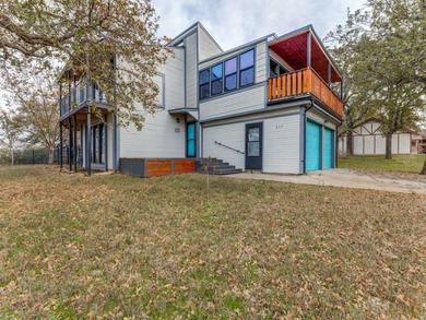 Discover Your Dream Lake House with Spectacular Sunset Views! on The Club At Runaway Bay in Texas - for sale on GolfHomes.com, golf home, golf lot