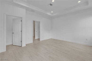 Experience modern Florida living in this beautifully designed on Burnt Store Golf Club in Florida - for sale on GolfHomes.com, golf home, golf lot