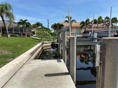 ESCAPE TO YOUR WATERFRONT DREAM HOME IN PUNTA GORDA ISLES! This on Saint Andrews South Golf Club in Florida - for sale on GolfHomes.com, golf home, golf lot