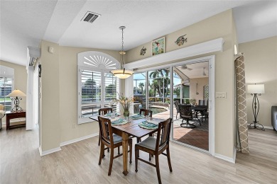 ESCAPE TO YOUR WATERFRONT POOL HOME IN PUNTA GORDA ISLES! This on Saint Andrews South Golf Club in Florida - for sale on GolfHomes.com, golf home, golf lot