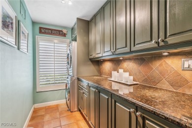 Beautifully maintained 4 bedroom 2.5 bathroom pool home on an on Royal Palm Golf Club in Florida - for sale on GolfHomes.com, golf home, golf lot
