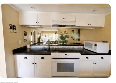 Step into a tastefully, fully furnished 2nd-floor condominium in on Sun n Lake Golf and Country Club in Florida - for sale on GolfHomes.com, golf home, golf lot