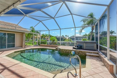 ESCAPE TO YOUR WATERFRONT POOL HOME IN PUNTA GORDA ISLES! This on Saint Andrews South Golf Club in Florida - for sale on GolfHomes.com, golf home, golf lot
