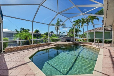 ESCAPE TO YOUR WATERFRONT POOL HOME IN PUNTA GORDA ISLES! This on Saint Andrews South Golf Club in Florida - for sale on GolfHomes.com, golf home, golf lot