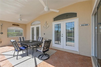 ESCAPE TO YOUR WATERFRONT POOL HOME IN PUNTA GORDA ISLES! This on Saint Andrews South Golf Club in Florida - for sale on GolfHomes.com, golf home, golf lot