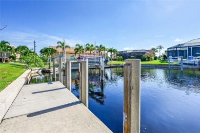 PRICED TO SELL!! THIS WATERFRONT, POOL HOME IN PUNTA GORDA ISLES on Saint Andrews South Golf Club in Florida - for sale on GolfHomes.com, golf home, golf lot
