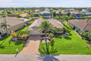 PRICED TO SELL!! THIS WATERFRONT, POOL HOME IN PUNTA GORDA ISLES on Saint Andrews South Golf Club in Florida - for sale on GolfHomes.com, golf home, golf lot
