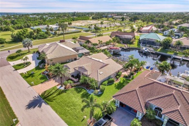 PRICED TO SELL!! THIS WATERFRONT, POOL HOME IN PUNTA GORDA ISLES on Saint Andrews South Golf Club in Florida - for sale on GolfHomes.com, golf home, golf lot