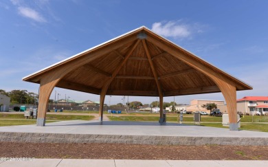 This beautiful three bedroom condo on the golf course at Caswell on Oak Island Golf Club in North Carolina - for sale on GolfHomes.com, golf home, golf lot