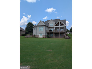 Welcome home - a charming 5 bedroom, 3.5 bath, Craftsman home on Traditions of Braselton Golf Club in Georgia - for sale on GolfHomes.com, golf home, golf lot