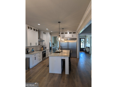 Welcome home - a charming 5 bedroom, 3.5 bath, Craftsman home on Traditions of Braselton Golf Club in Georgia - for sale on GolfHomes.com, golf home, golf lot