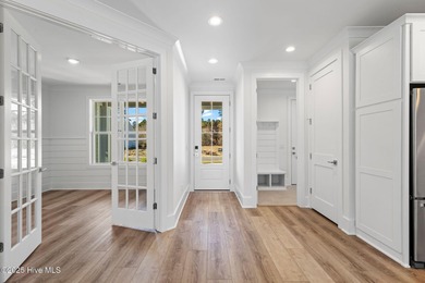 The Sanderling IV by Bell Custom Homes offers a spacious on Cape Fear National At Brunswick Forest in North Carolina - for sale on GolfHomes.com, golf home, golf lot