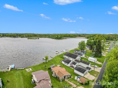 Don't miss this incredible opportunity to own the lakehouse of on Holland Lake Golf Course Inc. in Michigan - for sale on GolfHomes.com, golf home, golf lot