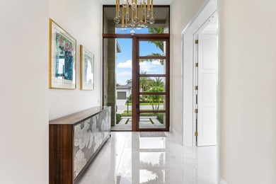 An architectural gem newly constructed in 2024, this on St. Andrews Country Club of Boca Raton in Florida - for sale on GolfHomes.com, golf home, golf lot