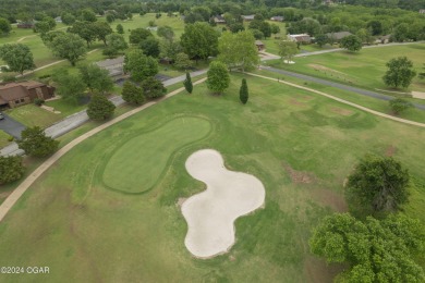 Luxurious retreat on the greens! Nestled within the landscapes on The Bald Eagle Course At Eagle Creek Golf Club in Missouri - for sale on GolfHomes.com, golf home, golf lot