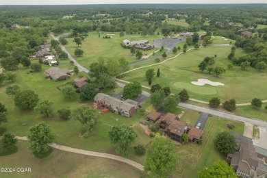 Luxurious retreat on the greens! Nestled within the landscapes on The Bald Eagle Course At Eagle Creek Golf Club in Missouri - for sale on GolfHomes.com, golf home, golf lot