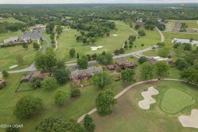 Luxurious retreat on the greens! Nestled within the landscapes on The Bald Eagle Course At Eagle Creek Golf Club in Missouri - for sale on GolfHomes.com, golf home, golf lot