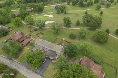 Luxurious retreat on the greens! Nestled within the landscapes on The Bald Eagle Course At Eagle Creek Golf Club in Missouri - for sale on GolfHomes.com, golf home, golf lot