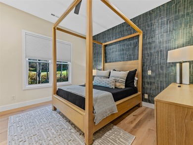 This light-filled mountain home blends modern design with the on Burlingame Country Club in North Carolina - for sale on GolfHomes.com, golf home, golf lot