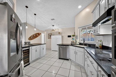 BRAND NEW ROOF! SPARKLING POOL! TWO PRIMARY BEDROOM SUITES! on The Grand Club - Pine Lakes Course in Florida - for sale on GolfHomes.com, golf home, golf lot