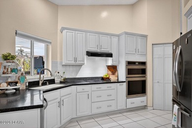 BRAND NEW ROOF! SPARKLING POOL! TWO PRIMARY BEDROOM SUITES! on The Grand Club - Pine Lakes Course in Florida - for sale on GolfHomes.com, golf home, golf lot