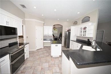 Welcome to this beautiful Pool home overlooking the Turtle Run on Sun n Lake Golf and Country Club in Florida - for sale on GolfHomes.com, golf home, golf lot