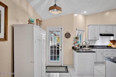 BRAND NEW ROOF! SPARKLING POOL! TWO PRIMARY BEDROOM SUITES! on The Grand Club - Pine Lakes Course in Florida - for sale on GolfHomes.com, golf home, golf lot