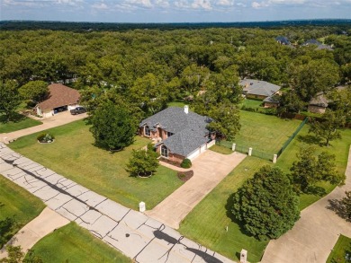 One owner custom built home with tons of recent updates located on Pecan Plantation Country Club in Texas - for sale on GolfHomes.com, golf home, golf lot