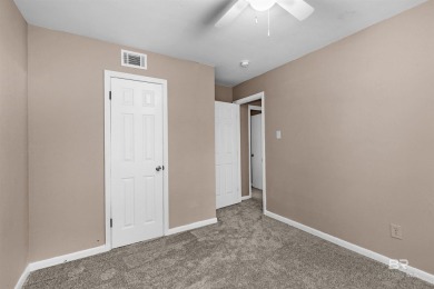 This updated 4-bedroom, 2-bath home is an excellent opportunity on Azalea City Golf Course in Alabama - for sale on GolfHomes.com, golf home, golf lot