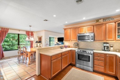 GREAT VALUE! Beautiful golf course & pond views in this lovely on Quail Ridge Golf Course and Country Club in Florida - for sale on GolfHomes.com, golf home, golf lot