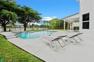 WELCOME TO THIS STUNNING COMPLETELY REMODELED 2 STORY RESIDENCE on Weston Hills Country Club in Florida - for sale on GolfHomes.com, golf home, golf lot