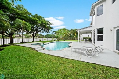WELCOME TO THIS STUNNING COMPLETELY REMODELED 2 STORY RESIDENCE on Weston Hills Country Club in Florida - for sale on GolfHomes.com, golf home, golf lot