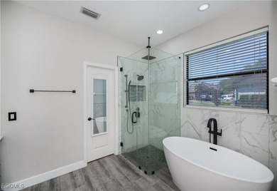 Welcome to this beautifully updated 4-bedroom, 3-bath pool home on Gateway Golf and Country Club in Florida - for sale on GolfHomes.com, golf home, golf lot