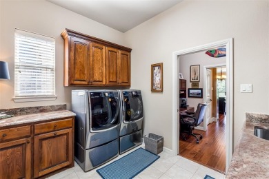 Welcome home to this charming custom residence tucked away on a on Pecan Plantation Country Club in Texas - for sale on GolfHomes.com, golf home, golf lot