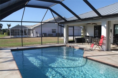 WATERFRONT pool home in Punta Gorda Isles, with intersecting on Saint Andrews South Golf Club in Florida - for sale on GolfHomes.com, golf home, golf lot