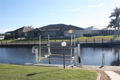 WATERFRONT pool home in Punta Gorda Isles, with intersecting on Saint Andrews South Golf Club in Florida - for sale on GolfHomes.com, golf home, golf lot