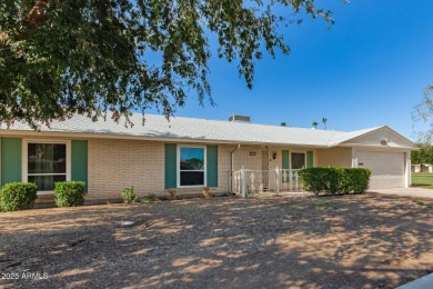 Nestled on a charming tree-lined street, this home offers on Sun City Lakes West and East in Arizona - for sale on GolfHomes.com, golf home, golf lot