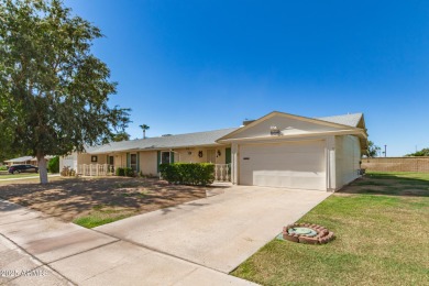Nestled on a charming tree-lined street, this home offers on Sun City Lakes West and East in Arizona - for sale on GolfHomes.com, golf home, golf lot