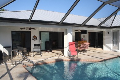 WATERFRONT pool home in Punta Gorda Isles, with intersecting on Saint Andrews South Golf Club in Florida - for sale on GolfHomes.com, golf home, golf lot