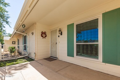 Nestled on a charming tree-lined street, this home offers on Sun City Lakes West and East in Arizona - for sale on GolfHomes.com, golf home, golf lot