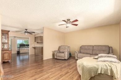 Nestled on a charming tree-lined street, this home offers on Sun City Lakes West and East in Arizona - for sale on GolfHomes.com, golf home, golf lot