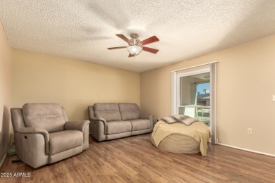 Nestled on a charming tree-lined street, this home offers on Sun City Lakes West and East in Arizona - for sale on GolfHomes.com, golf home, golf lot