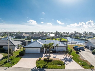 WATERFRONT pool home in Punta Gorda Isles, with intersecting on Saint Andrews South Golf Club in Florida - for sale on GolfHomes.com, golf home, golf lot