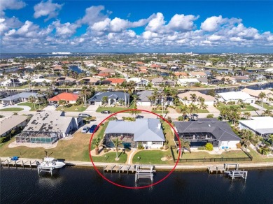 WATERFRONT pool home in Punta Gorda Isles, with intersecting on Saint Andrews South Golf Club in Florida - for sale on GolfHomes.com, golf home, golf lot