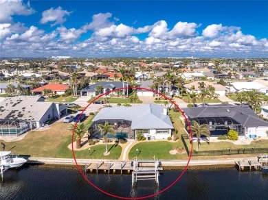 WATERFRONT pool home in Punta Gorda Isles, with intersecting on Saint Andrews South Golf Club in Florida - for sale on GolfHomes.com, golf home, golf lot