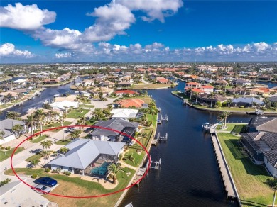 WATERFRONT pool home in Punta Gorda Isles, with intersecting on Saint Andrews South Golf Club in Florida - for sale on GolfHomes.com, golf home, golf lot